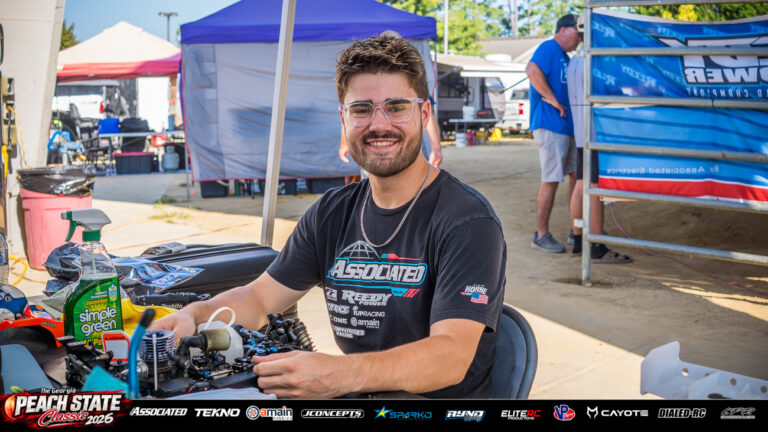 Aydin Horne smiles while working on a nitro buggy at his Team Associated pit table at the 2026 Georgia Peach State Classic. A candid moment from the race weekend’s Good Times photo gallery.