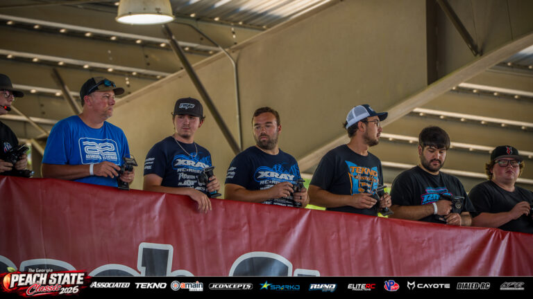 Dakotah Phend, Tater Sontag and fellow racers hold their transmitters on the drivers’ stand during practice at the 2026 Georgia Peach State Classic. A candid moment from the race weekend’s Good Times photo gallery.