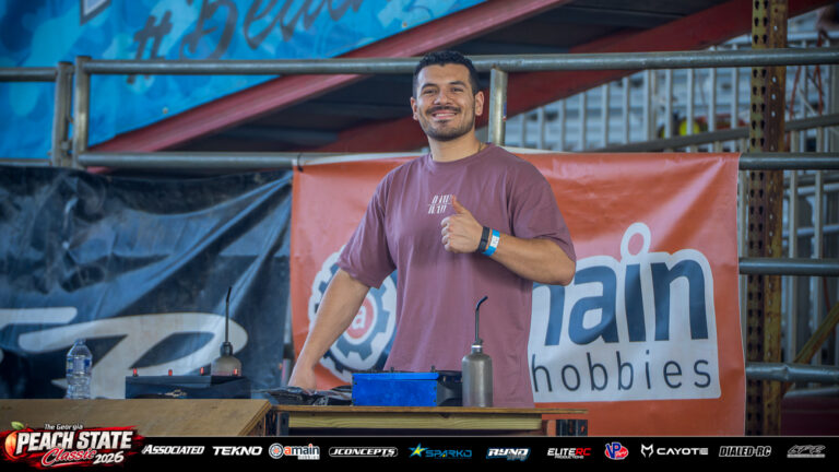 JP Seanz gives a thumbs-up beside pit lane equipment at the 2026 Georgia Peach State Classic. A candid moment from the race weekend’s Good Times photo gallery.