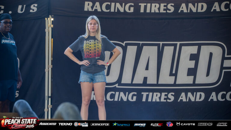 Makenzi Brand stands trackside with her hands on her hips during turn marshalling at the 2026 Georgia Peach State Classic. A candid moment from the race weekend’s Good Times photo gallery.