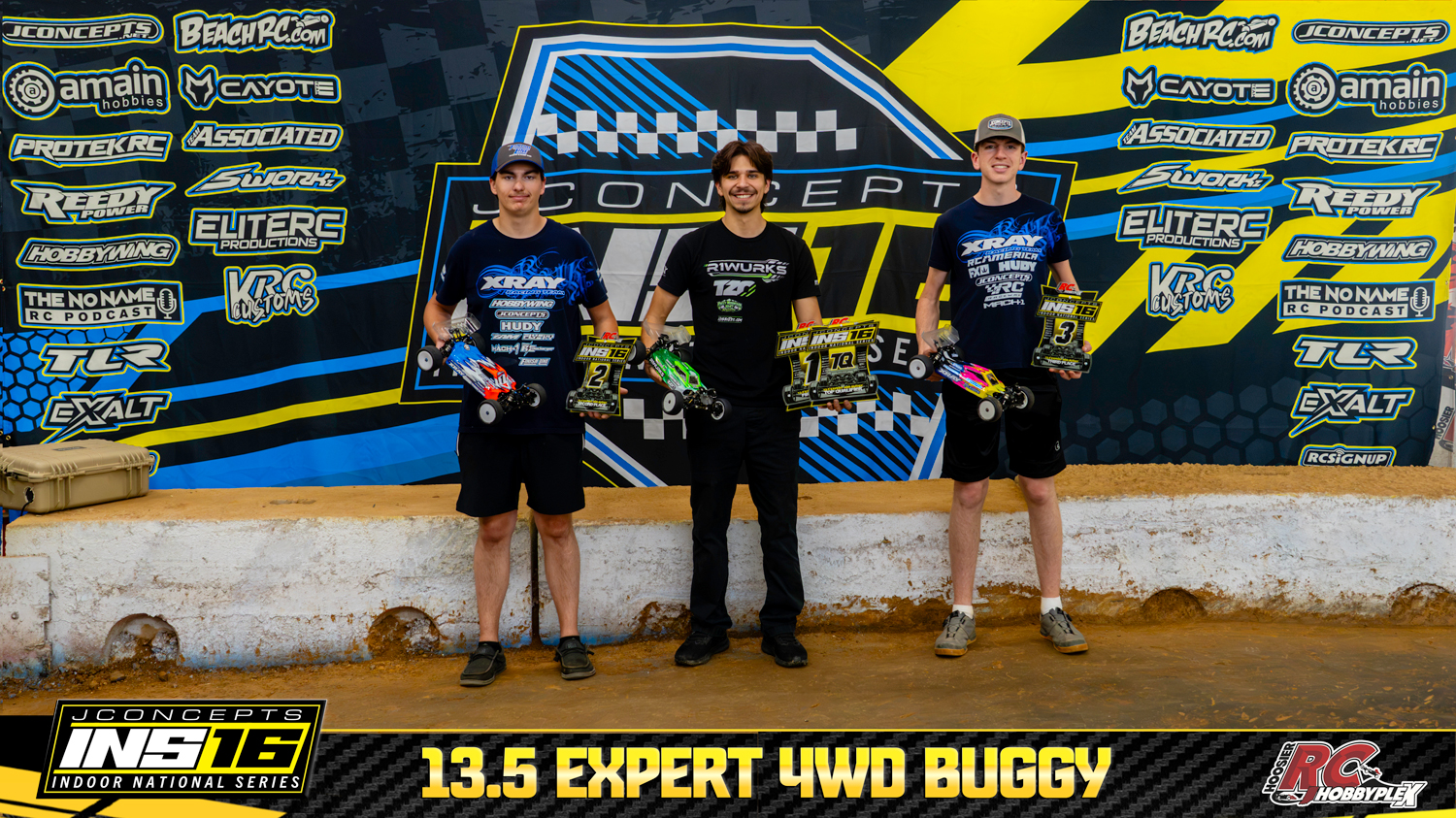 13.5 Expert 4WD Buggy round winners holding RC vehicles and podium awards at the 2026 JConcepts INS16 Finals at Hoosier RC Hobbyplex.