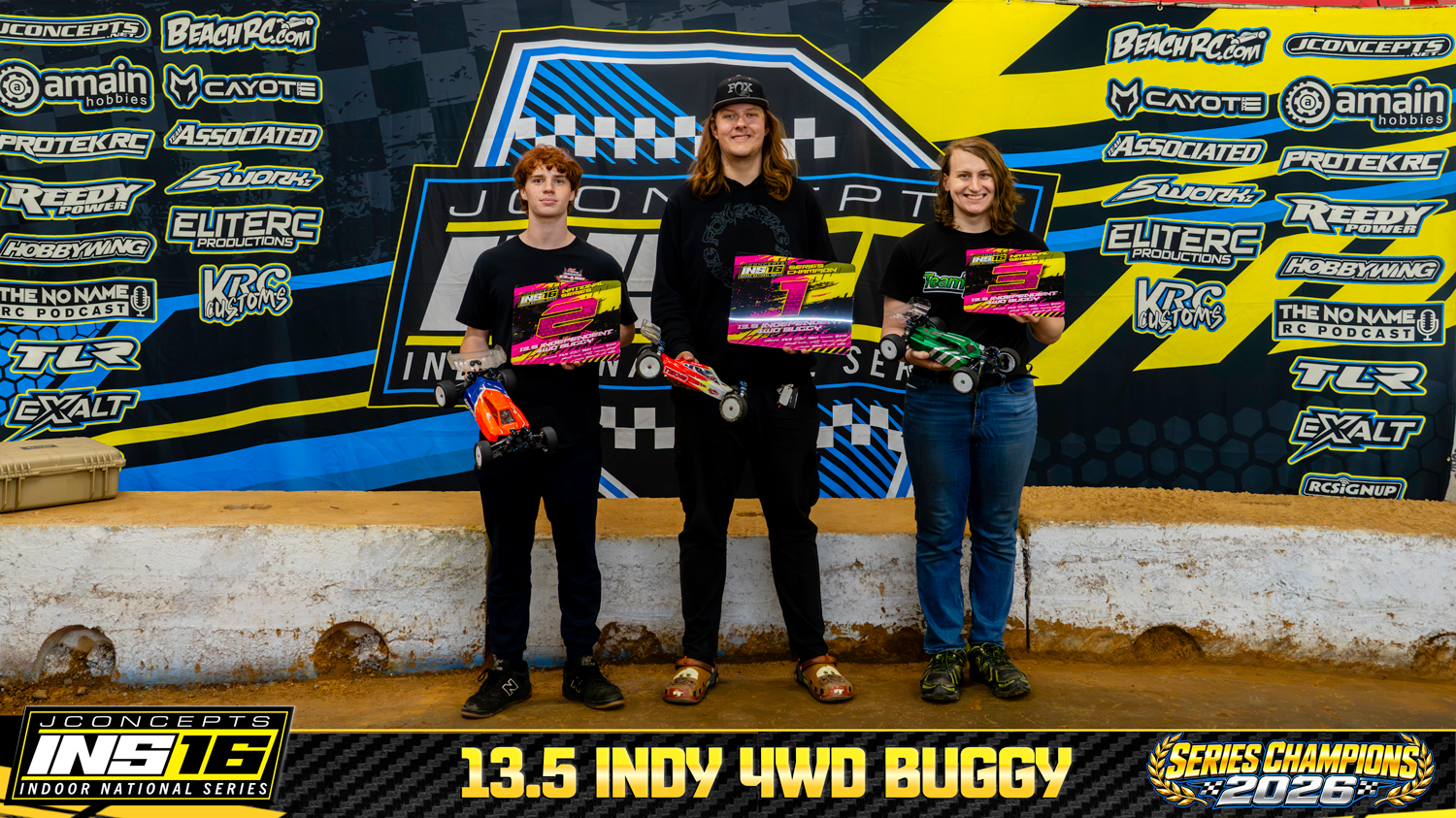 13.5 Indy 4WD Buggy INS16 2026 Champions holding RC vehicles and series awards.