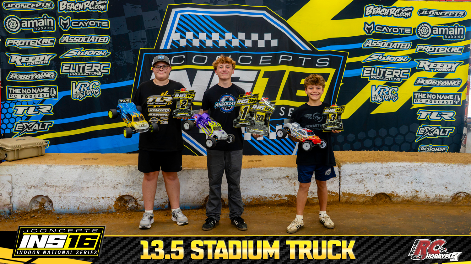 13.5 Stadium Truck round winners holding RC vehicles and podium awards at the 2026 JConcepts INS16 Finals at Hoosier RC Hobbyplex.