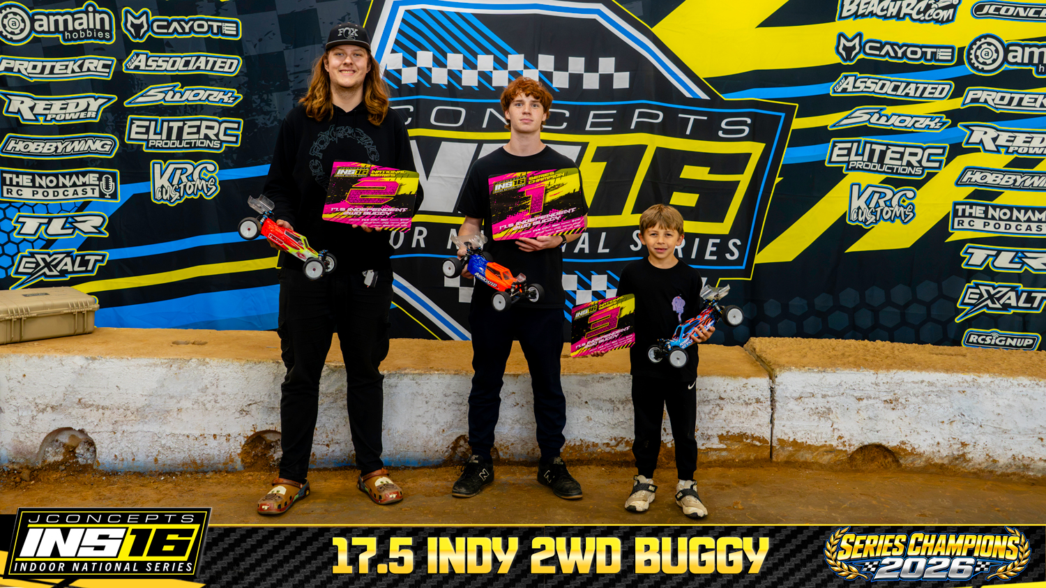17.5 Indy 2WD Buggy INS16 2026 Champions holding RC vehicles and series awards.