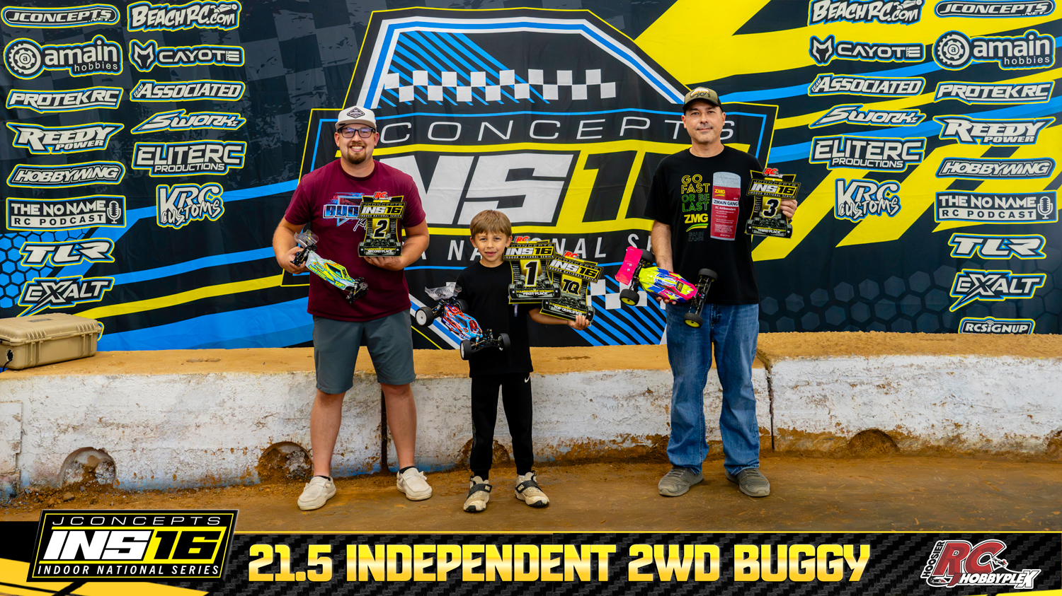21.5 Independent 2WD Buggy round winners holding RC vehicles and podium awards at the 2026 JConcepts INS16 Finals at Hoosier RC Hobbyplex.