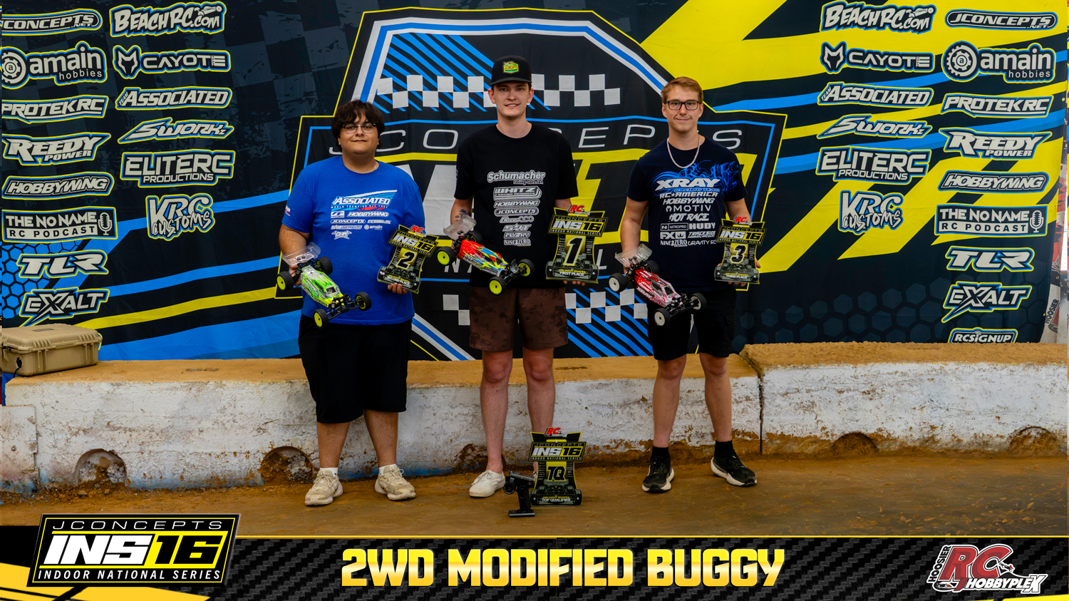 2WD Modified Buggy round winners holding RC vehicles and podium awards at the 2026 JConcepts INS16 Finals at Hoosier RC Hobbyplex.
