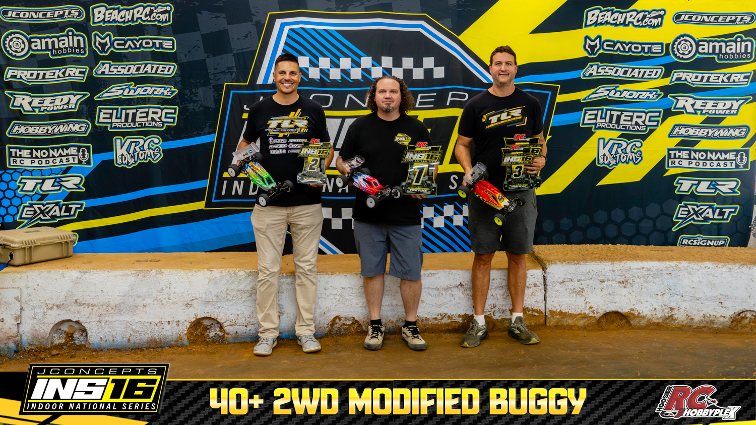 40+ 2WD Modified Buggy round winners holding RC vehicles and podium awards at the 2026 JConcepts INS16 Finals at Hoosier RC Hobbyplex.