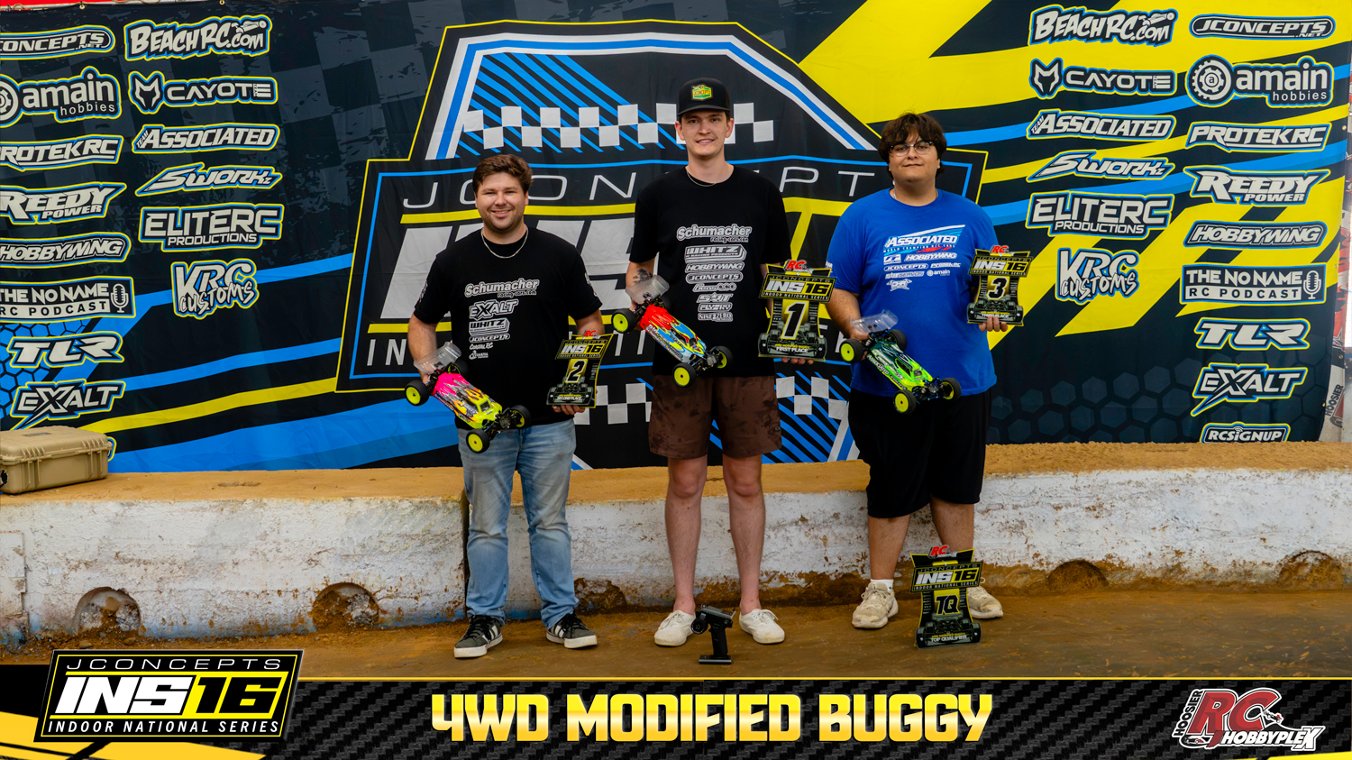 4WD Modified Buggy round winners holding RC vehicles and podium awards at the 2026 JConcepts INS16 Finals at Hoosier RC Hobbyplex.