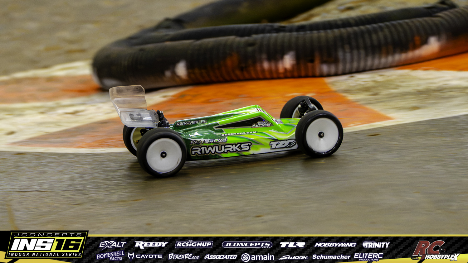 Domnic Paccione’s green R1Wurks 2WD buggy racing at the 2026 JConcepts INS Finals